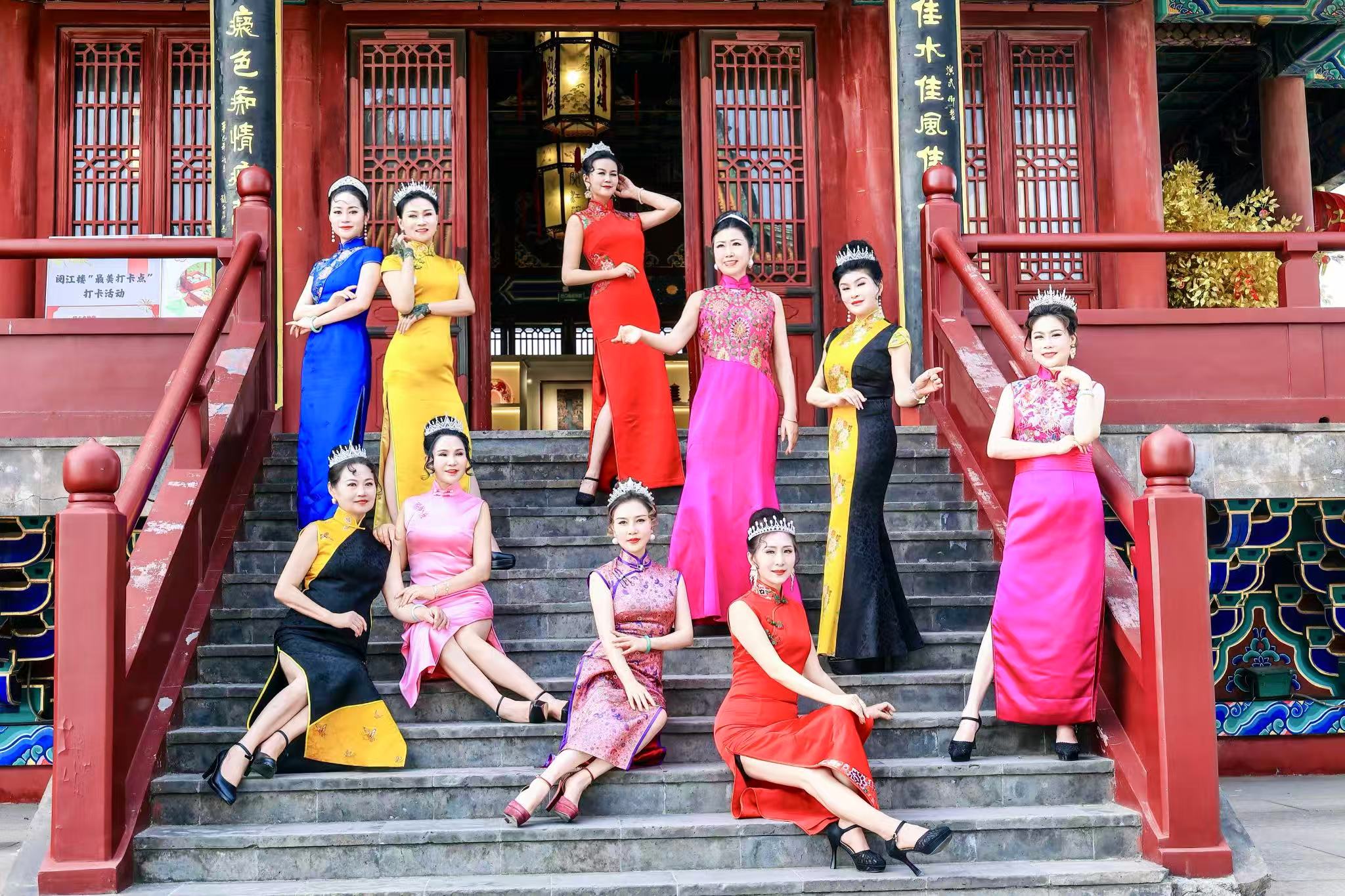 A group of women posing on stairs
Description automatically generated